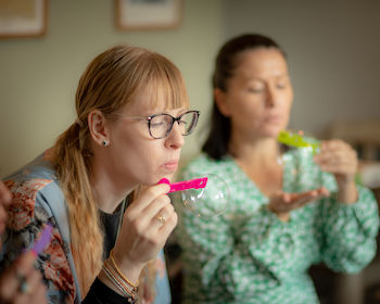 Lady Blowing Bubbles